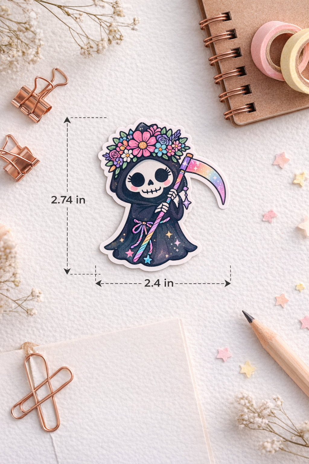 Decorative sticker of a skeleton with a rainbow sword on a textured surface with stationery items.