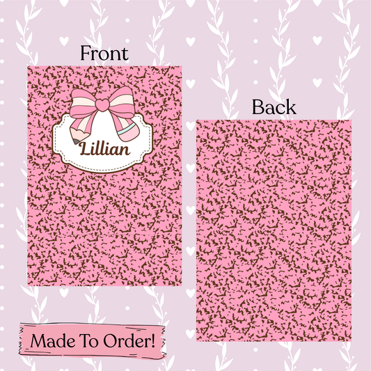 custom composition notebook design with a bow and name 'Lillian' on a matching pink background.