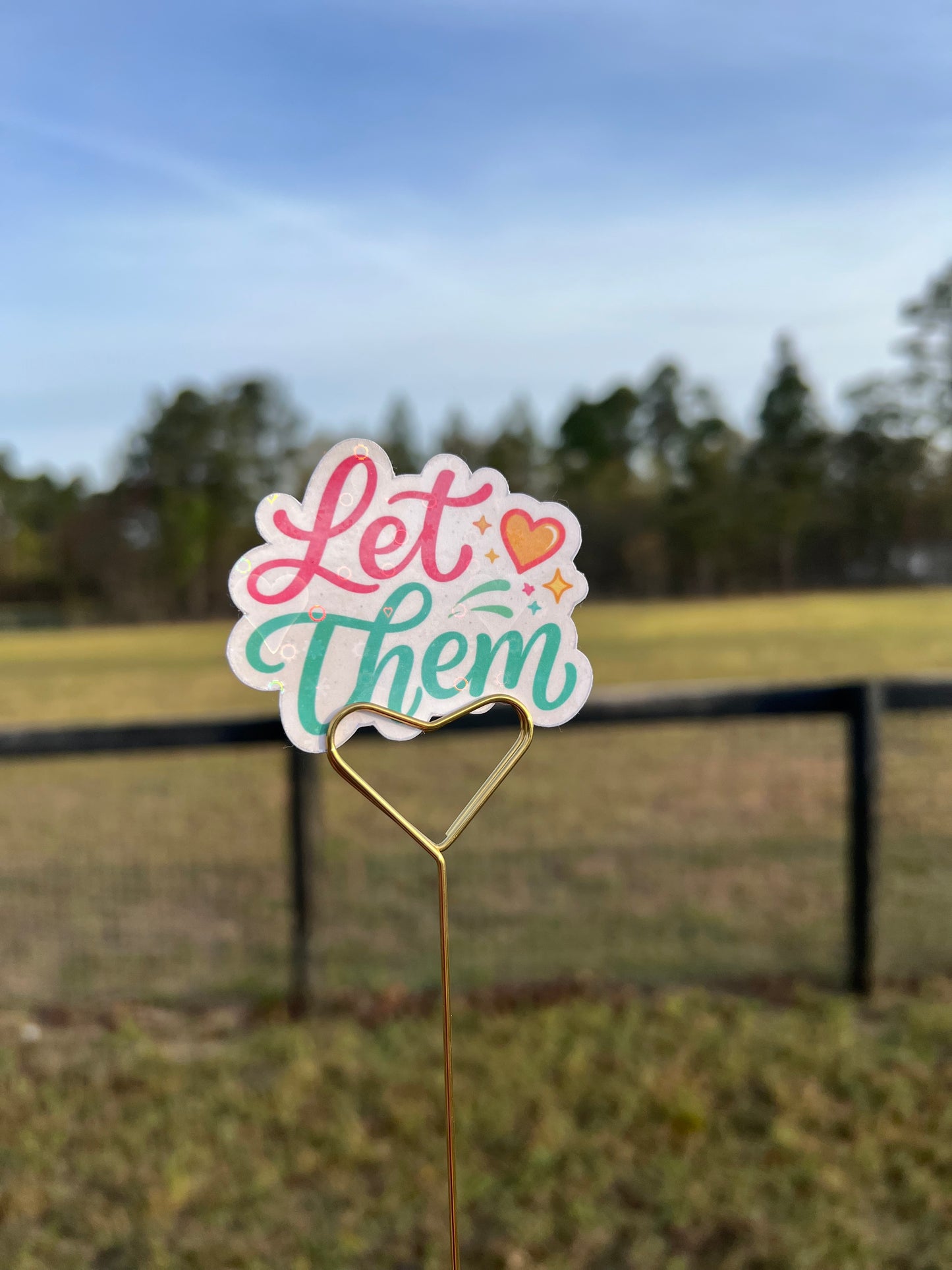 Decorative sign with 'Let It Be' text on a sticker