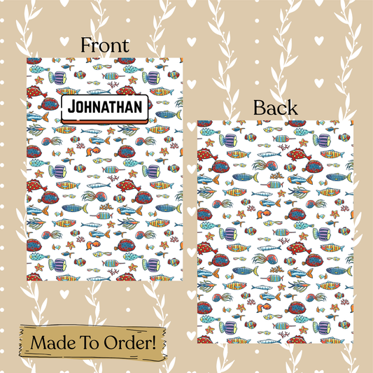 Underwater-themed stationery set with 'JOHNATHAN' printed on a card, displayed on a decorative background.